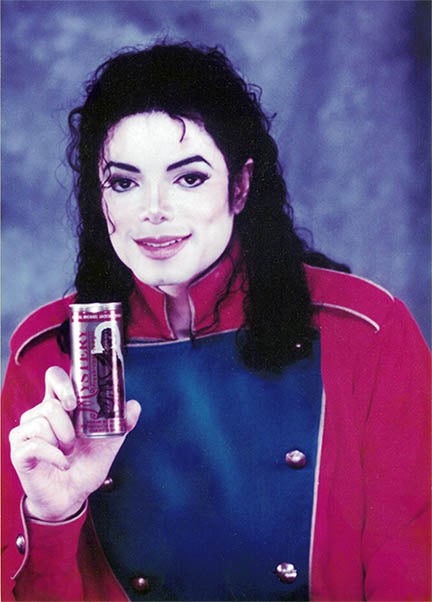 MJ holding a can of his energy drink.